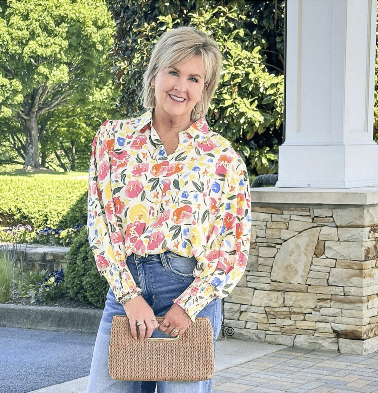 Tania Stephens is wearing a Yellow Lantern Sleeve Blouse and a Straw Clutch